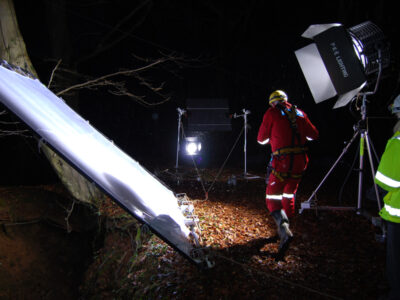 Positioning of lighting equipment above a mine entrance.